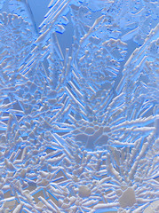 Snow patterns on glass as an abstract background