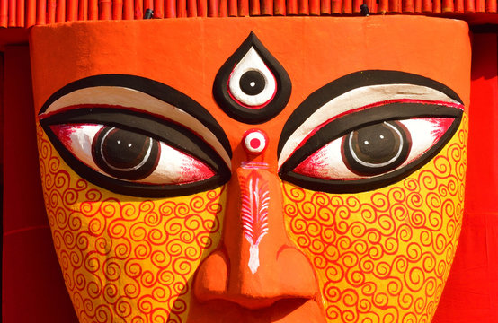 Close up of the eyes of an idol of Hindu goddess Durga.