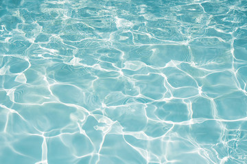 Texture of water in swimming pool for background