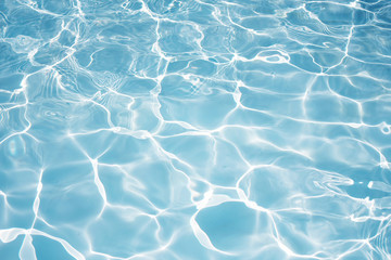 Texture of water in swimming pool for background