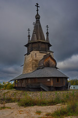 Fototapeta na wymiar Russia. Karelia. Ancient Orthodox Church on the shore of lake Ladoga, built of wood without a single nail