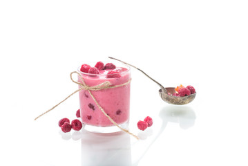 sweet organic smoothie with raspberry on wooden