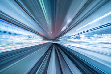 Motion blur of train moving inside tunnel with daylight in tokyo, Japan.