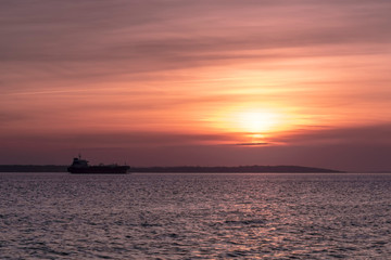 Fototapeta na wymiar Minimalism Tanker Sunset