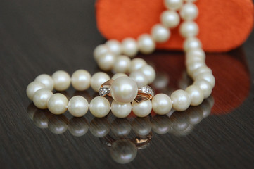 pearl necklace on black background