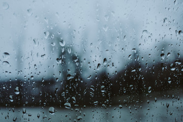 small drops of rain on the car window in the afternoon