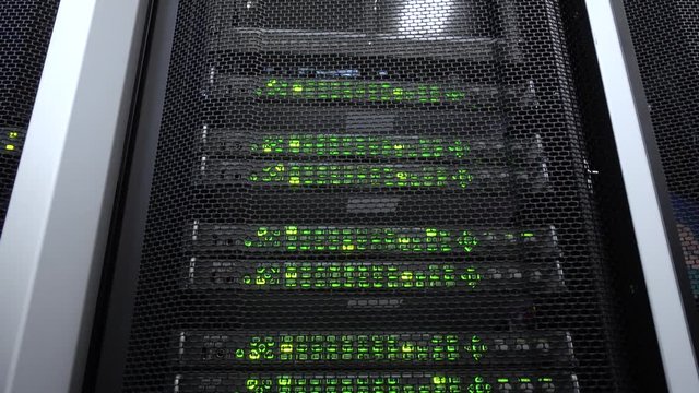 Close-up view of modern server. Data center green blink. Motion camera.
