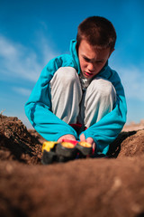 Cute little boy playing with truck toy