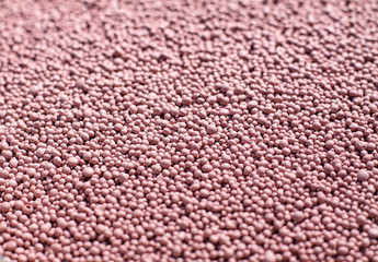 Fertilizer for the garden with minerals. Nitrates for rapid plant growth. Beautiful texture. Stock background, photo