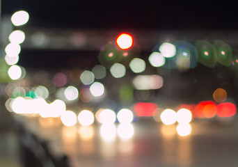 Bokeh of the car lights on the street at night. Abstract texture bokeh