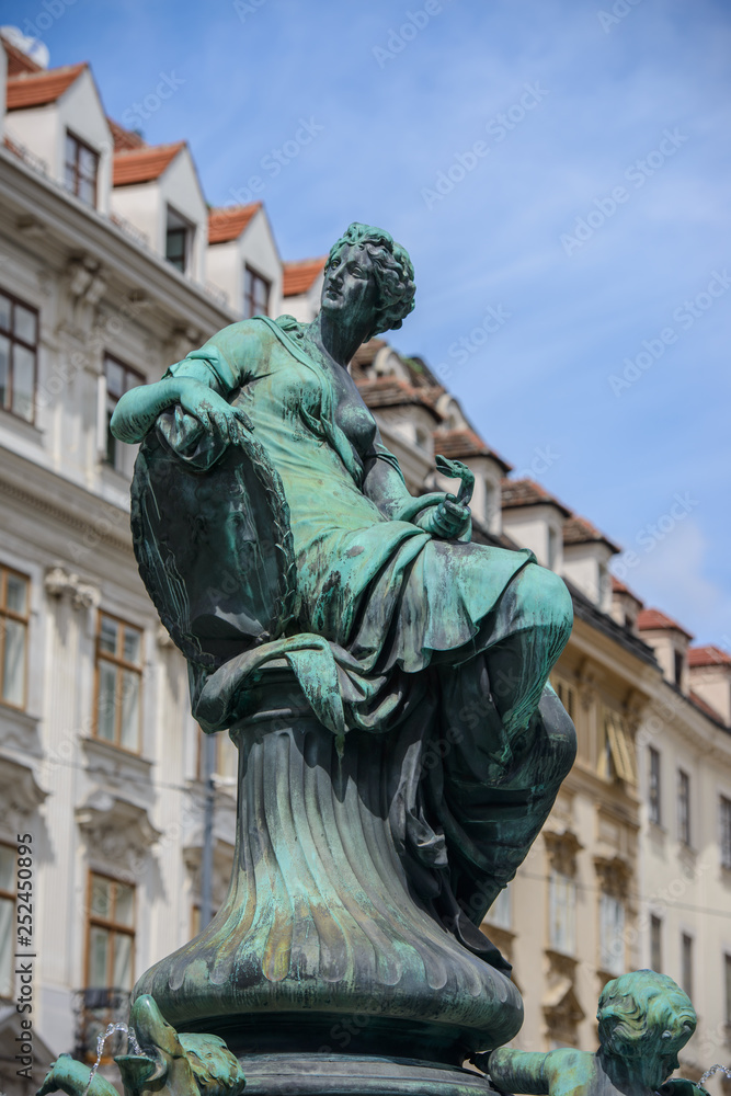 Wall mural VIENNA, AUSTRIA - AUGUST 11, 2017: Donnerbrunnen fountain in Vienna, Austria. Baroque fountain located on Neuer Markt square. The fountain was built in 1737