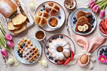 Foto op Plexiglas Easter festive dessert table with hot cross buns, cakes, waffles and pancakes. Overhead view © losangela