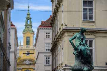 Fototapeta premium VIENNA, AUSTRIA - AUGUST 11, 2017: Donnerbrunnen fountain in Vienna, Austria. Baroque fountain located on Neuer Markt square. The fountain was built in 1737