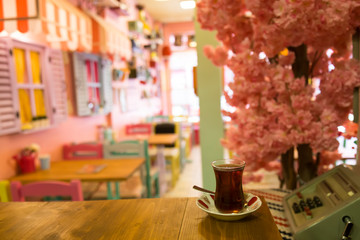 A cup of coffee,service cake in the plate and tea for concept.