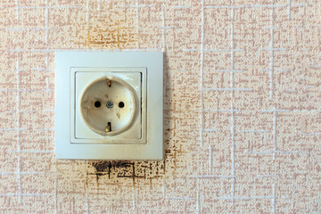 socket. because of the short circuit burned. close-up. no flame.