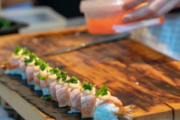 preparing salmon sushi