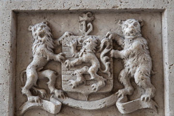 Detail of a lion of Flanders sculpture on a historical monument in the historical centre of Bruges