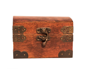 Closed wooden vintage box for storing jewelry on a white background