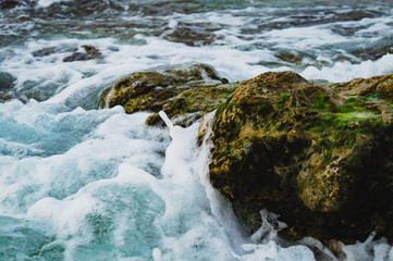 Waves crashing on rocks
