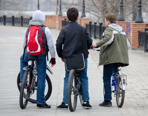 Three teenagers on bikes