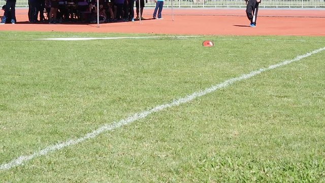 Discus throwing in the sport stadium on grass.