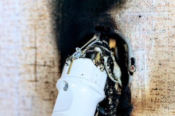 socket. she burned out. plugged into it. close-up.