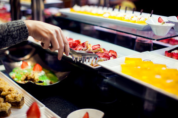 Close up delicious dessert pastry cakes. Fresh colourful sweet berry desserts, beautifull decorated in Egypt