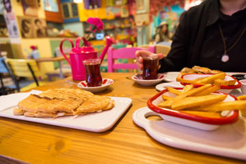 A cup of coffee,service cake in the plate and tea for concept.