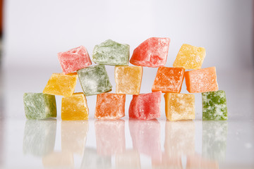 Different colours Turkish delight isolated on white background.