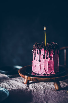 Close up of raspberry birthday cake on plate