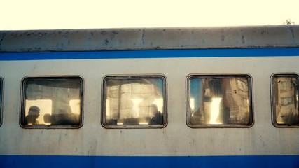 4k - Curious people looking out of a train windows in slow motion