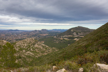 Fototapeta na wymiar A view from the mountain top to small town in Spain.