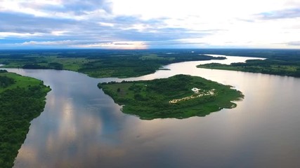 An arty bird`s eye view of a motorboat on the picturesque sunset