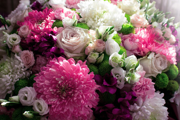 Many colored flowers.Bouquet of roses and pions