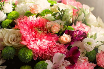 Many colored flowers.Bouquet of roses and pions