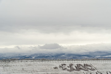Winter landscape with clouds