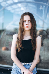 Portrait of caucasian sensual emotional teen depressed girl outdoors. Adolescence, urban, beauty concept