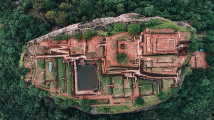 Close shot by drone in Sigiriya, Sri Lanka. Aerial view of lion rock in the tropical forest