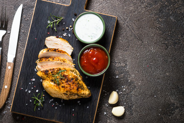 Chicken steak with sauces top view.