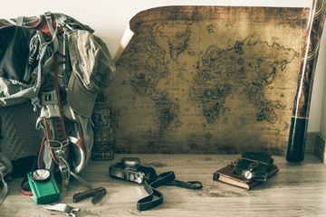 Old map, vintage travel equipment and souvenirs from the travel around the world / place for your text