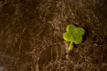  clover-shaped cookies for saint patrick's day on marble