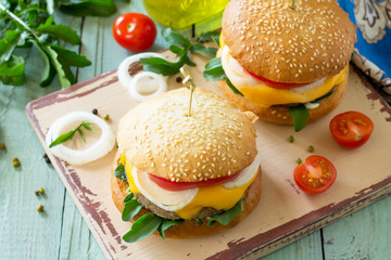 Arabic cuisine, Ramadan food. Delicious fresh Big sandwich - hamburger burger with vegetarian mung cutlets burger on a wooden kitchen table.