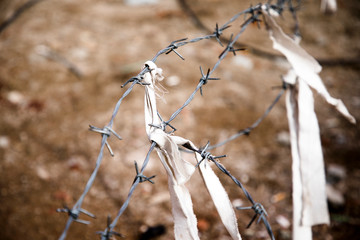 Barbed wire on a brown background