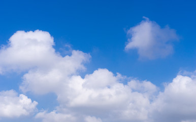 Naklejka na ściany i meble white cloud on blue sky with copy space on sky