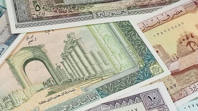 Old Lebanon pound banknotes slow rotating. Lebanese money currency. Low angle. Stock video footage.