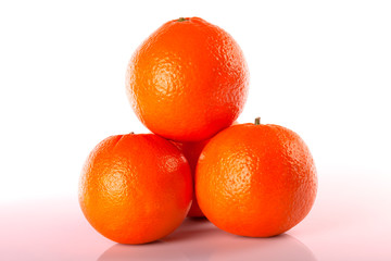 Four oranges stacked isolated