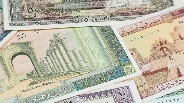 Old Lebanon pound banknotes slow rotating. Lebanese money currency. Low angle. Stock video footage.