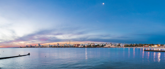 Amazing colorful Montevideo cityscape with the last sunbeams coming from the sunset illuminating the twilight sky with amazing colors on a wonderful city skyline of the old Montevideo town