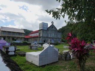 Wide shot of the old graveyard and church of the Assumption in St. Lucia, Caribbean Islands