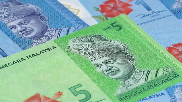Malaysia currency ringgit notes slow rotating. Malaysian money. Low angle. Stock video footage
